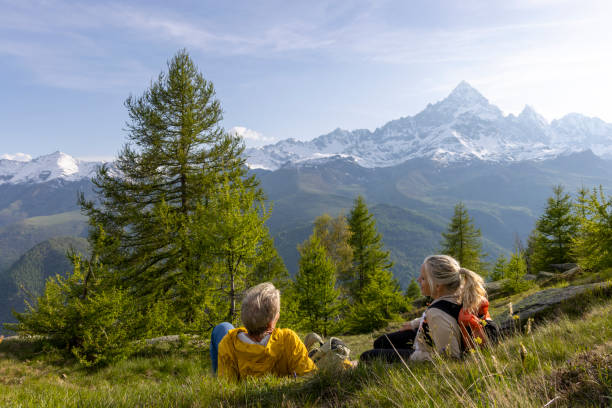 istock Mature couple explore mountain meadow in morning light 1494790889