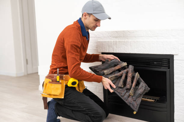 istock Professional technician installing electric fireplace in room. 1494791813