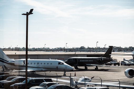 The everyday scenery at the airport showcases the contrasting views inside and outside the perimeter fence.