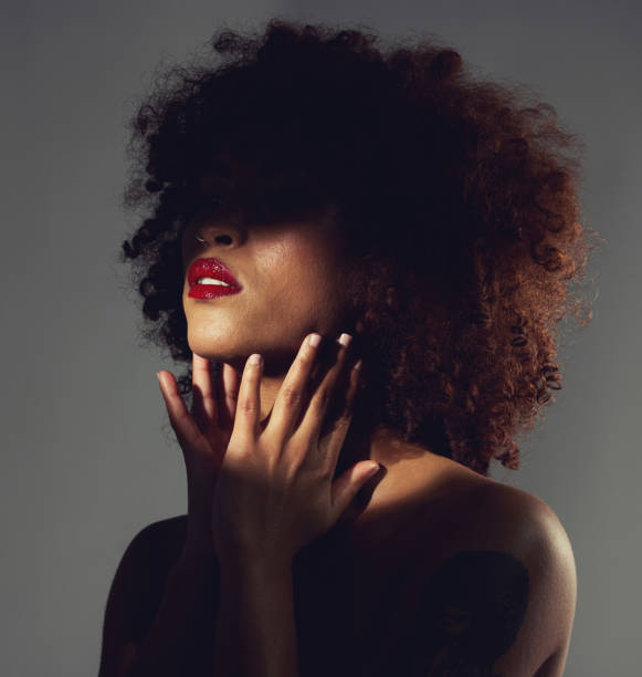 istock Black woman, red lipstick and shadow with beauty and makeup, hands with spotlight on studio background. Cosmetics, creative and aesthetic with beautiful female, cosmetology and art deco with manicure 1494794845