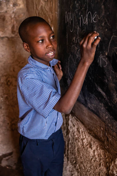 istock African young boy is learning English language, orphanage in Kenya 1494797788