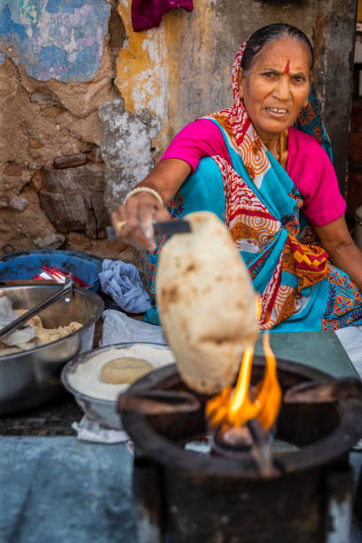 istock Indian street vendor preparing food - chapatti, flat bread 1494798571