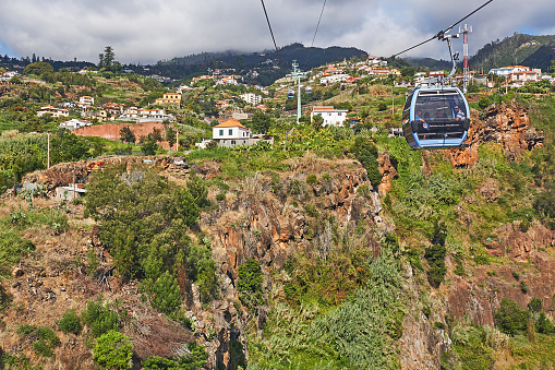 Funchal, Portugal - November 21, 2022: Passengers take the Funchal cable car to Monte.