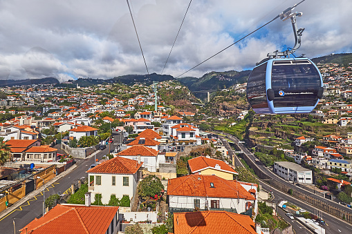 Funchal, Portugal - November 21, 2022: Passengers take the Funchal cable car to Monte.