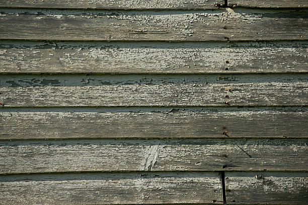 istock Old weathered wood wall in sunlight. 149480855