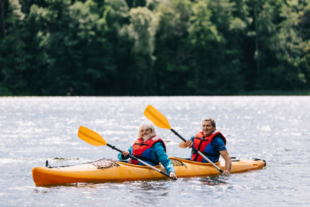 istock Happy senior active couple kayaking on lake 1494809522
