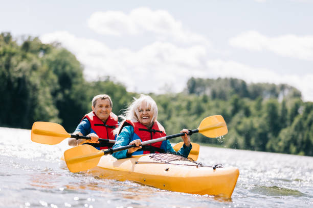 istock Happy senior active couple kayaking on lake 1494809534