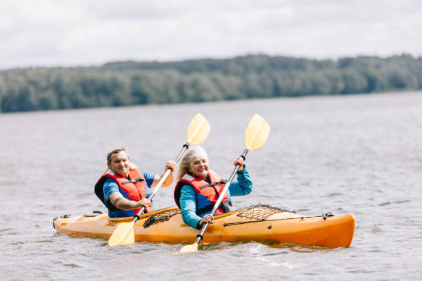 istock Happy senior active couple kayaking on lake 1494809543