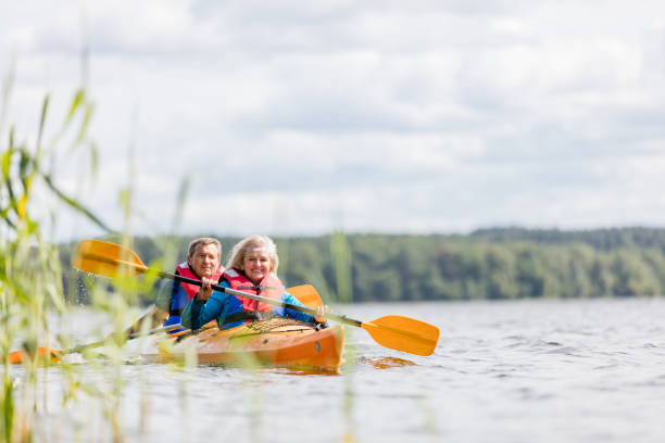 istock Happy senior active couple kayaking on lake 1494809560