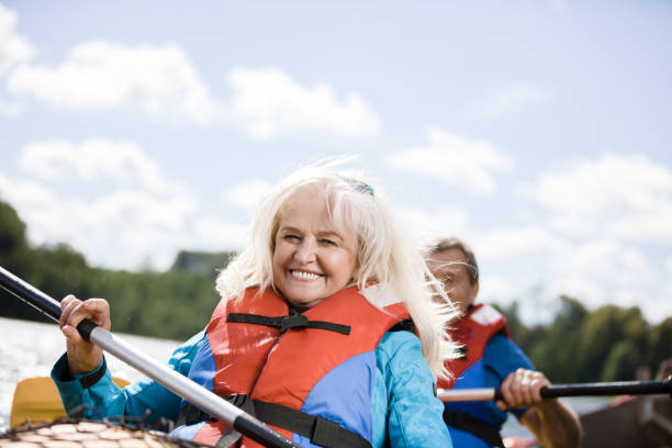 istock Happy senior active couple kayaking on lake 1494809569
