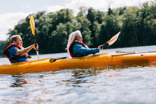 istock Happy senior active couple kayaking on lake 1494809591