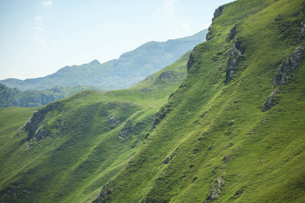 Stiff slope at high mountains covered with grass