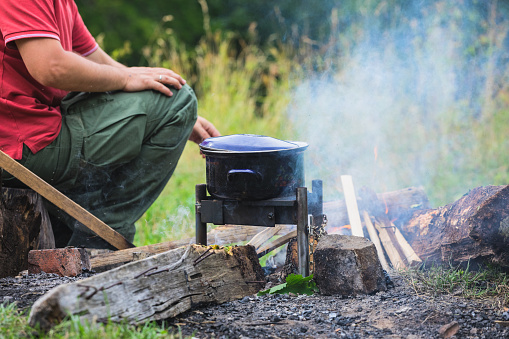 Outdoor cooking,  cooking pot over open fire