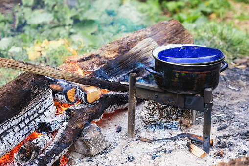 Outdoor cooking,  cooking pot over open fire