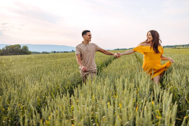 may we always be this happy - couple human pregnancy sunset walking imagens e fotografias de stock