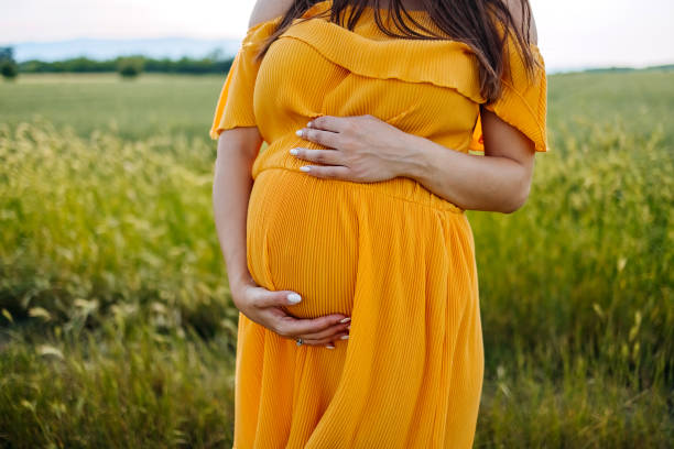 istock Pregnant woman in nature 1494813388