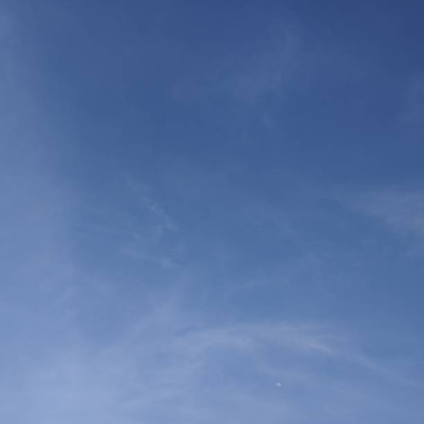 istock Blue sky with white cloud background. Light clouds in the blue sky. 1494815551