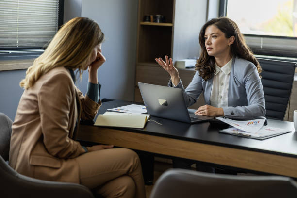 istock Angry boss yelling at her employee, she is stressed and feeling frustrated on work 1494816473
