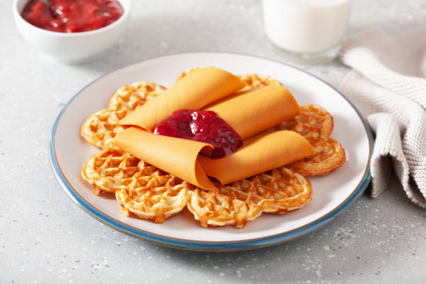 istock waffles with Norwegian brunost traditional brown cheese and raspberry jam 1494816799