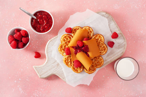 istock waffles with Norwegian brunost traditional brown cheese and raspberry jam 1494816816