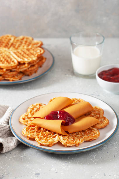 istock waffles with Norwegian brunost traditional brown cheese and raspberry jam 1494816821