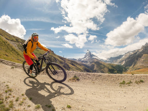 istock Female mountain biker on dirt trail, Switzerland 1494817604