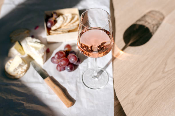 istock A glass of rose wine with appetizers on a white background. 1494820305
