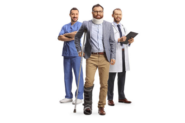 doctors with an injured man standing with a crutch and wearing a cervical collar - physical injury men orthopedic equipment isolated on white imagens e fotografias de stock