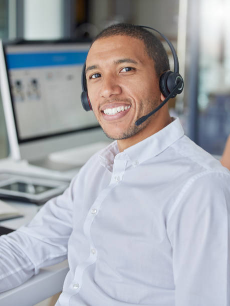 black man, call center portrait and smile by computer for consulting, contact us and tech support in office. crm expert, consultant and customer service agent with happiness, telemarketing and sales - center occupation headset on the phone imagens e fotografias de stock