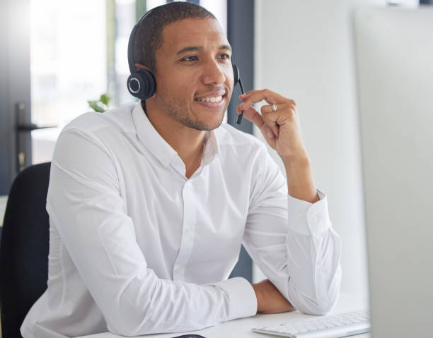 istock Call center, computer and consulting with man in office for customer service, contact us and sales. Help desk, operator and advisory with employee for communication, technical support and hotline 1494836136