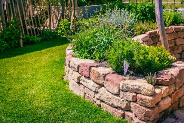 istock Herb spiral made of bricks for a small garden with green lawn 1494837620