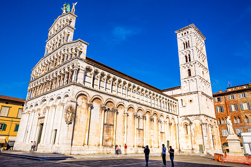 Lucca, Tuscany, Italy 06 October 2022:People on the square of the basilica of San Michele