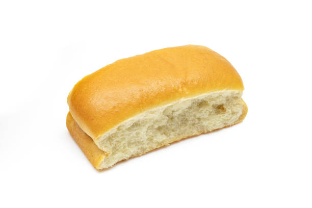 istock Single soft milky bun. Brioche golden pastry isolated on white background 1494839192