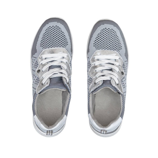 istock women's sports sneakers isolated on white background. 1494840934