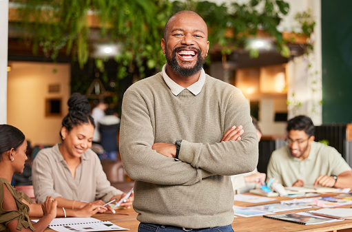 istock Black man, portrait smile and arms crossed in meeting for leadership, teamwork or brainstorming at office. Happy businessman, leader or coach smiling in management for team planning and collaboration 1494842167