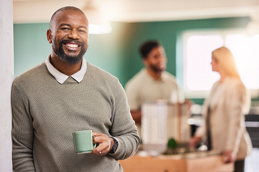 Black man, portrait smile and leadership with coffee for meeting, teamwork or collaboration at office. Happy businessman, leader or coach smiling in management with cup in team planning at workplace