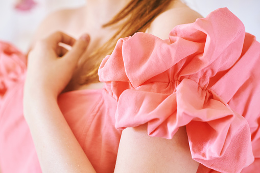Fashion details, voluminous linen sleeve of pink coral dress
