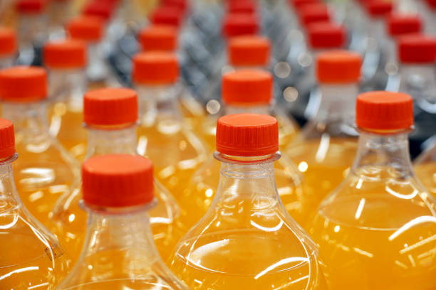istock Plastic bottles of sweet soda in a row, selective focus 1494843151