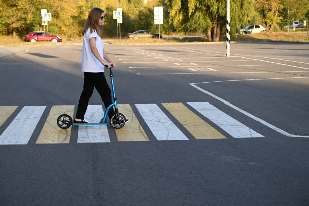 istock Beautiful and blonde girl practicing long board on the road 1494843788