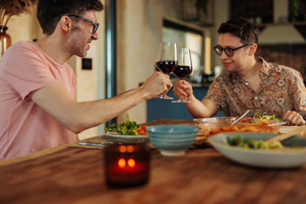 istock Gay couple toasting with wine. 1494845560