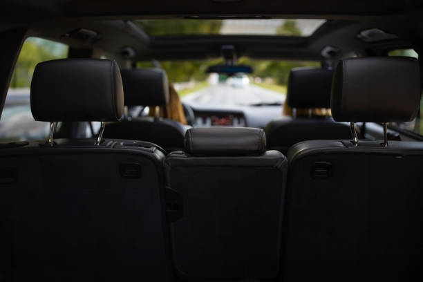 Couple go into a trip with a car, view from the back