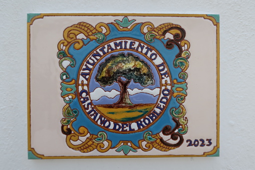 Castano del Robledo, Huelva, Spain, May 24, 2023: Coat of arms of the Town Hall of the Andalusian magical town of Castaño del Robledo, Huelva, Spain