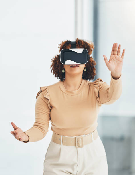 istock Virtual reality, metaverse and business woman in the office planning a digital project with a headset. VR, 3d and professional female employee designing a graphic company report in the workplace. 1494851235