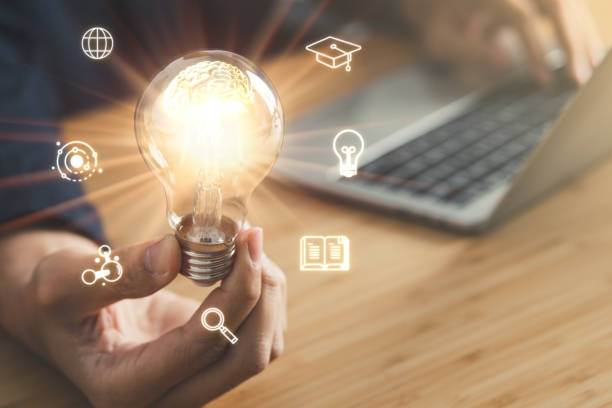 istock Business man holding light bulb. New idea, innovation technology and creative concept. 1494854036