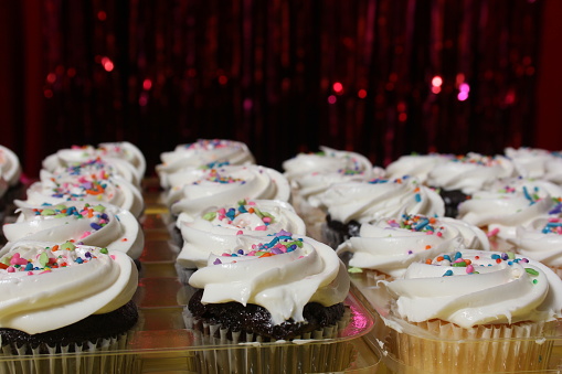 Cupcakes with Sprinkles on Table at Birthday Party Event