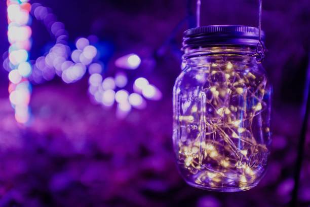 istock Clear glass jar filled with colorful lights 1494854394
