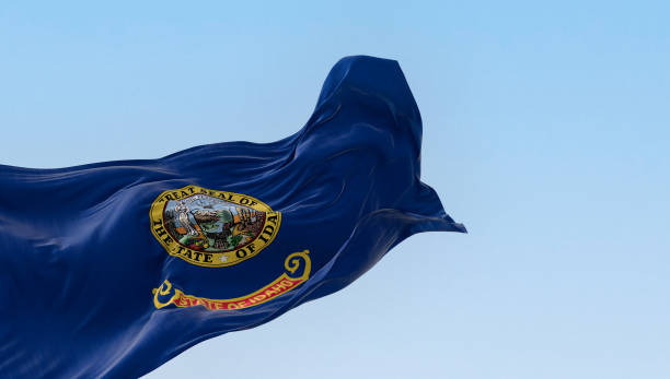 istock Idaho state flag fluttering in the wind on a clear day 1494855499