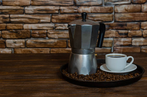 istock Geyser coffee maker and cup of black coffee 1494856680