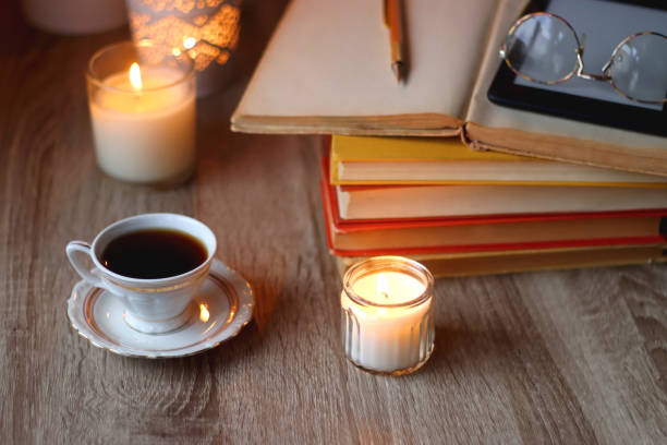 istock Books, Glasses, E-Reader, Pen, Tea, Cookies and Candles 1494856766