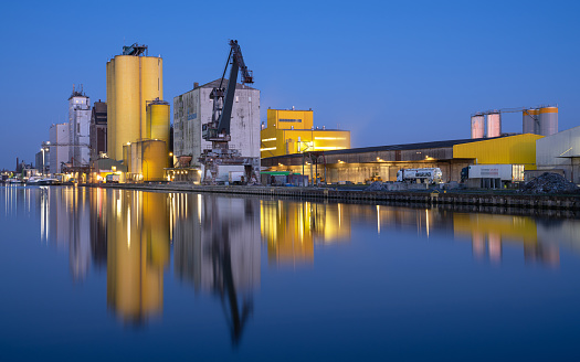 Hamm, Germany - February 28, 2023: Port of Hamm during blue hour with water reflection on February 28, 2023 in Germany